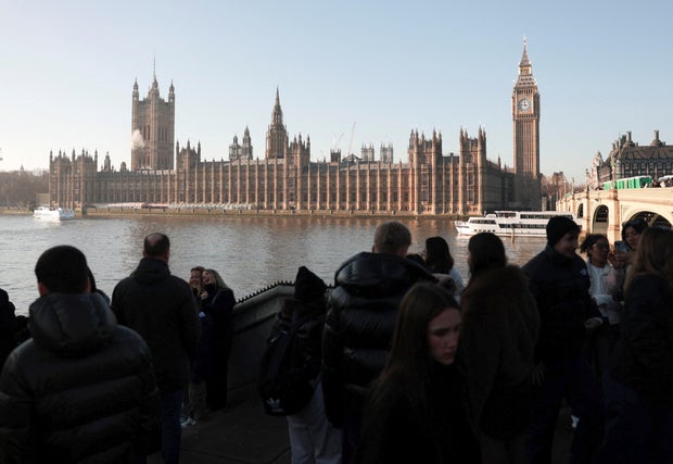 Visitors gather on Westminster Bridge in London 