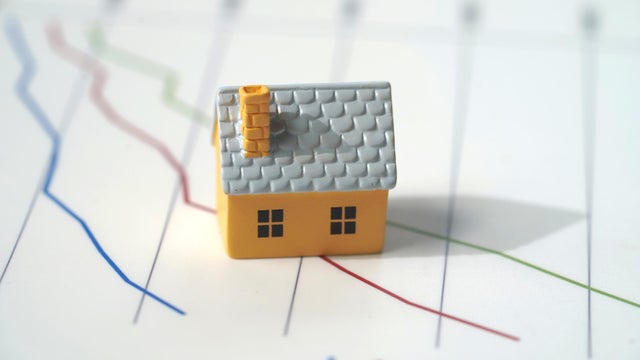 Housing and graph concept , with toy house 