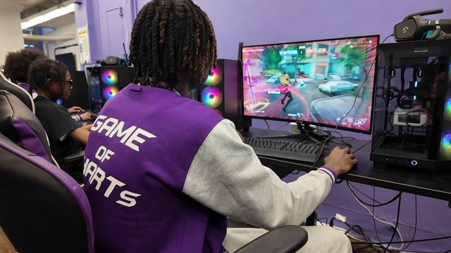 Students in a computer lab play video games on computers 