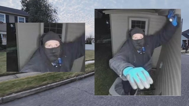 Photos from a Ring camera show the suspect wearing dark clothes, blue gloves and a mask covering his mouth 