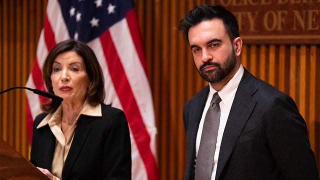 Left: New York Gov. Kathy Hochul delivers her State of the State address in the Assembly Chamber at the state Capitol, Tuesday, Jan. 10, 2023, in Albany, N.Y.; New York City Democratic mayoral candidate Zohran Mamdani is on stage at the March on Wall Stre 
