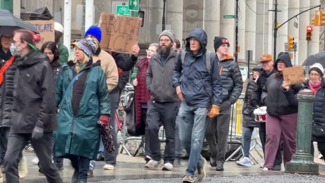Protesters walk through New York City, some carrying anti-ICE signs 