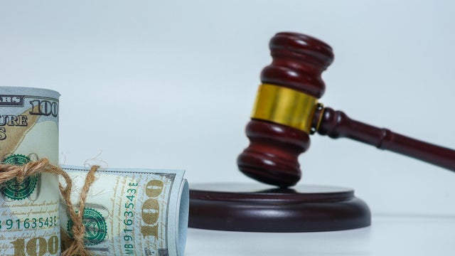 Financial Crime and Legal Consequences Concept with judge gavel and bundled cash 