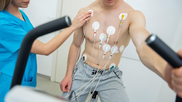 Medical professional conducting a cardiovascular evaluation with ecg electrodes 