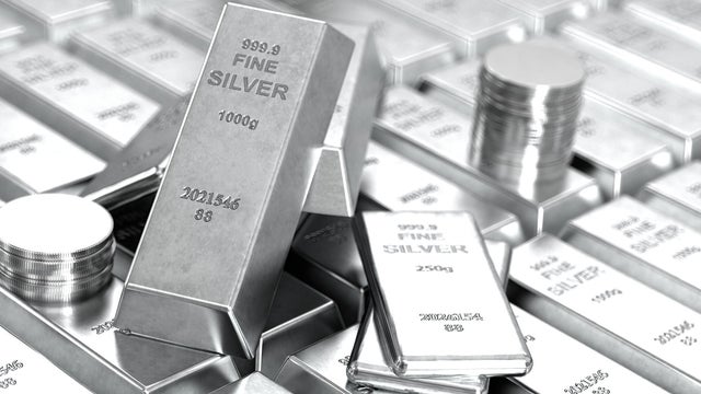 Pile of Fine Silver Bars and Coins Investment and Precious Metals 