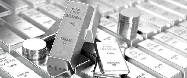 Pile of Fine Silver Bars and Coins Investment and Precious Metals 