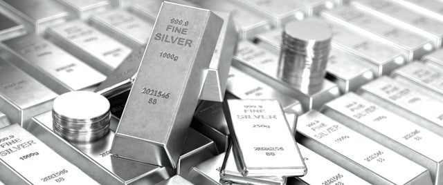 Pile of Fine Silver Bars and Coins Investment and Precious Metals 