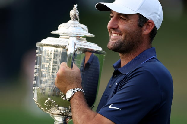 Scottie Scheffler of the United States poses with the Wanamaker Trophy after winning the 2025 PGA Championship 