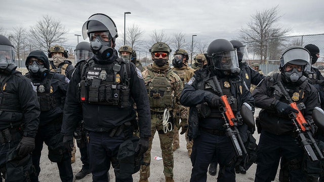 Federal law enforcement officers try to disperse demonstrators outside the Bishop Henry Whipple Federal Building in St. Paul, Minnesota, on Jan. 15, 2026. 