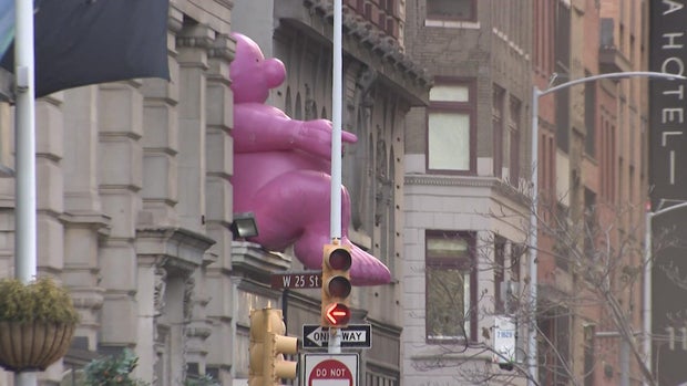 Mr. Pink sculpture on building 