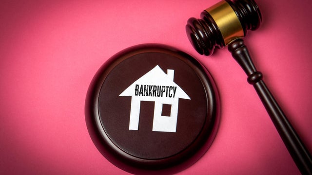 Bankruptcy Legal Concept with House Icon and Judge Gavel on Pink Background 
