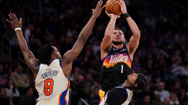 Devin Booker #1 of the Phoenix Suns shoots as OG Anunoby #8 and Jordan Clarkson #00 of the New York Knicks defend in the second half at Madison Square Garden on January 17, 2026 in New York City. 