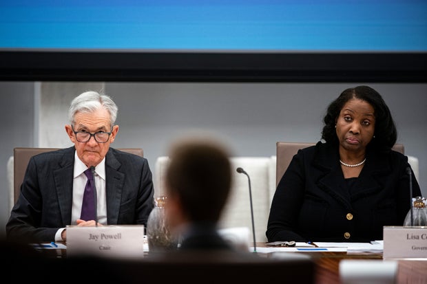 Jerome Powell and Lisa Cook during the Federal Reserve Board open meeting in Washington, D.C., on Wednesday, June 25, 2025.  