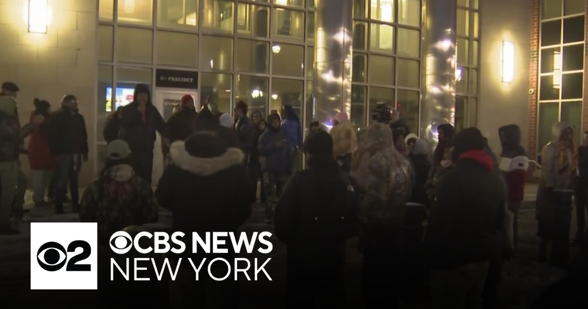 Newark community members rallies after a police shooting killed one, injured another