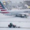 Flight cancellations pile up across the country amid major winter storms