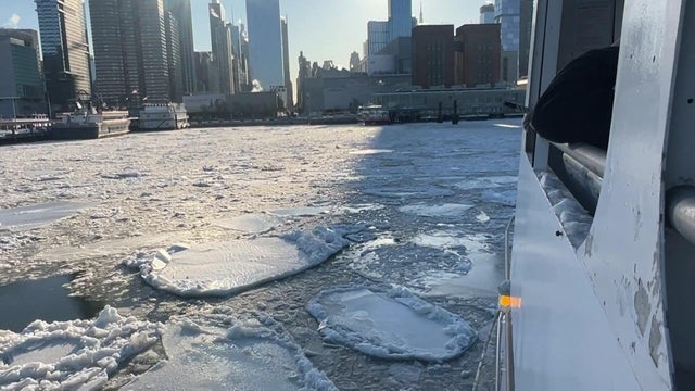 A ferry navigates an icy NYC river 