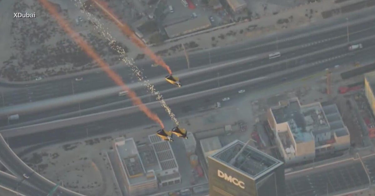 Dubai wingsuit team flies through world’s tallest hotel