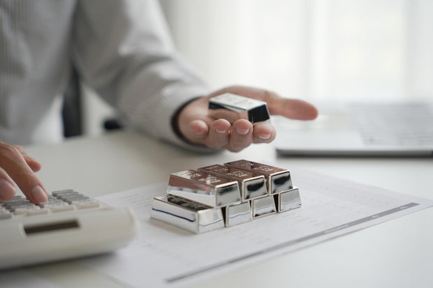 Silver Trading Businessman invest in trading silver on the stock exchange price rising. 