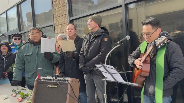 Faith leaders sing during a vigil outside the ICE detention center in Center City 