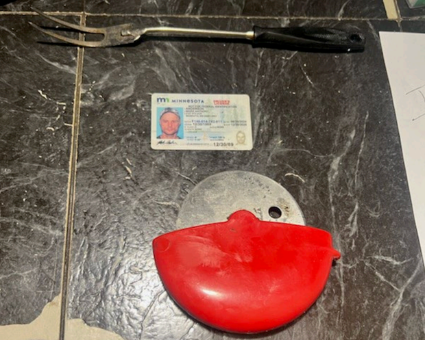 A fork, driver's license and steel blade found in the bag of a man arrested for impersonating an FBI agent, allegedly to free Luigi Mangione.
