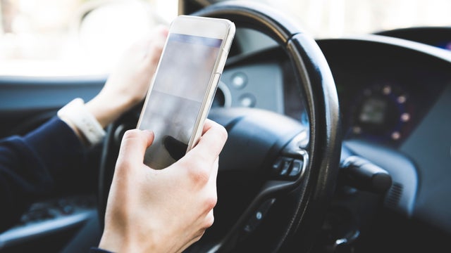 Using phone while driving car 