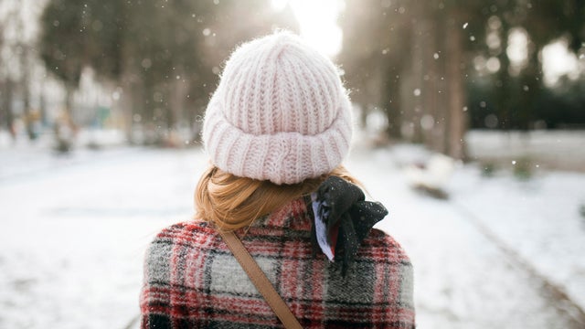 Rear view of Caucasian woman outdoors in snow 