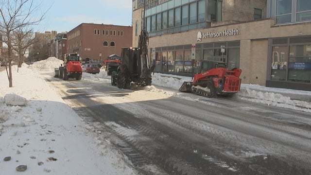 Construction vehicles clean up snow in Spring Garden on Sunday 