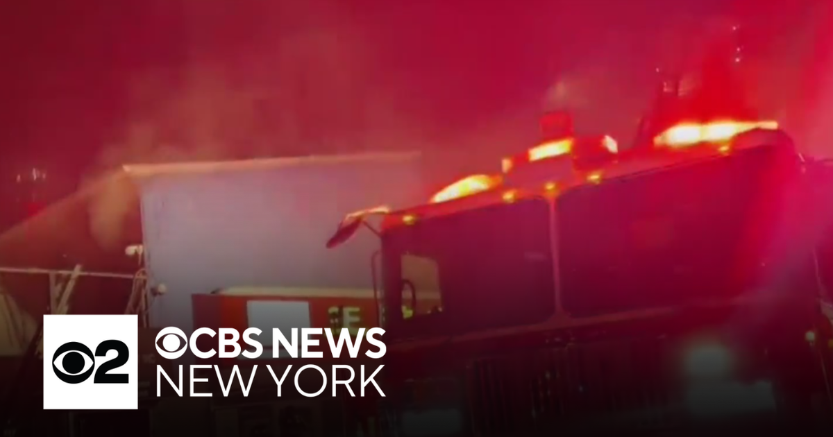 Crews battling 2-alarm fire at Queens warehouse - CBS New York