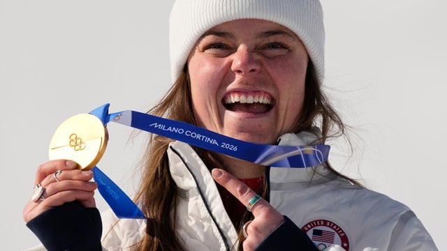 Team USA's Breezy Johnson shows her gold medal at the 2026 Winter Olympics 