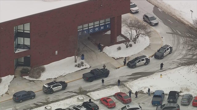 Law enforcement vehicles in the parking lot at Norristown Area High School 
