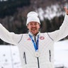 Silver medalist Ben Ogden of Team USA celebrates on the podium for the men's cross-country sprint at the Tesero Cross-Country Skiing Stadium in Lago, Italy, Feb. 10, 2026. 