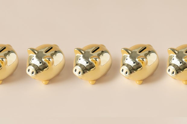 A enactment      of aureate  piggybank. 