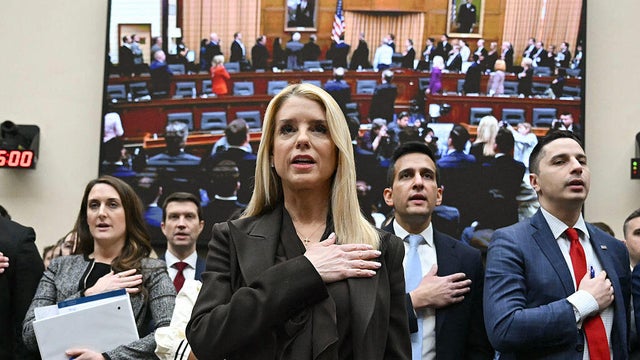 U.S. Attorney General Pam Bondi recites the Pledge of Allegiance before testifying at a House Judiciary Committee hearing on oversight of the Department of Justice in Washington, D.C., on Feb. 11, 2026. 