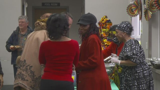 People inside of a building with festive decoration 