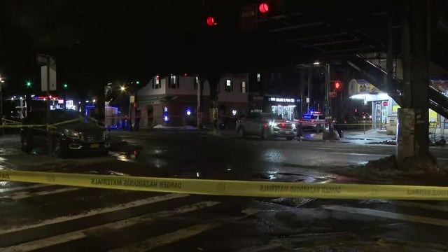 NYPD presence at an intersection under elevated subway tracks 