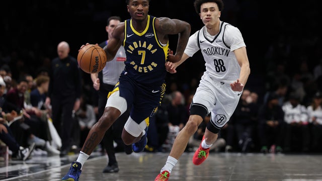 Kam Jones #7 of the Indiana Pacers dribbles the ball past Nolan Traore #88 of the Brooklyn Nets during the first quarter at Barclays Center on February 11, 2026 in the Brooklyn borough of New York City. 