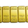 Gold bars 99.99% on a white background 