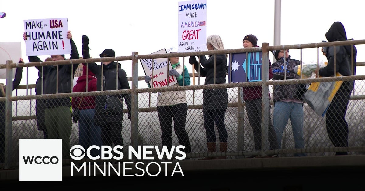 Crowd shows support after small protest sparks confrontation - CBS ...