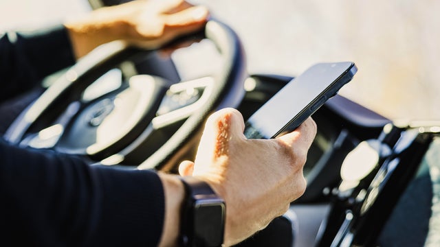 Man using phone while driving 