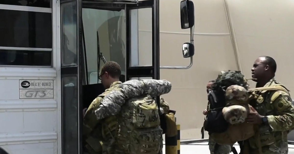 Tensions flare as Trump surges military assets and Iran warns of retaliation