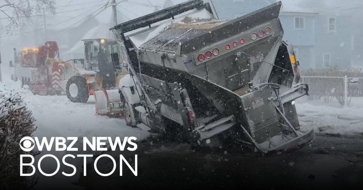 Plow truck gets swallowed into sinkhole during blizzard in Massachusetts