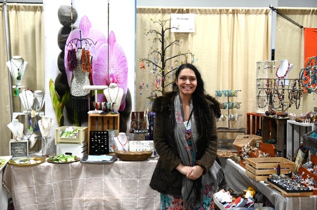 People pose for a photo at the opening day of the Philly Home and Garden show 