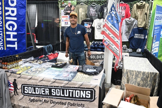 People pose for a photo at the opening day of the Philly Home and Garden show 