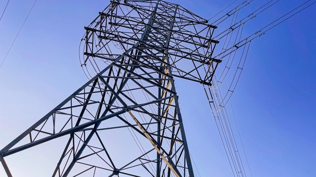 Electricity transmission tower violet blue sky 