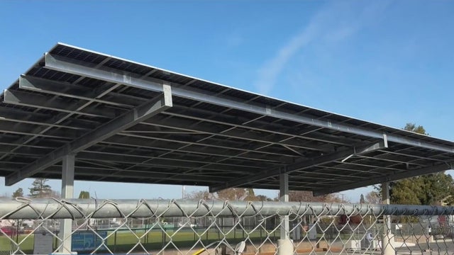 A solar panel structure over a parking lot 