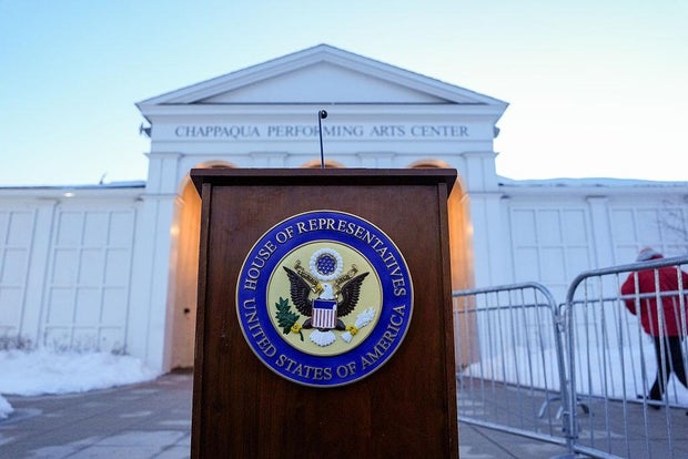 The seal of the House of Representatives appears on a podium outside the Chappaqua Performing Arts Center in Chappaqua, New York, on Feb. 26, 2026. 