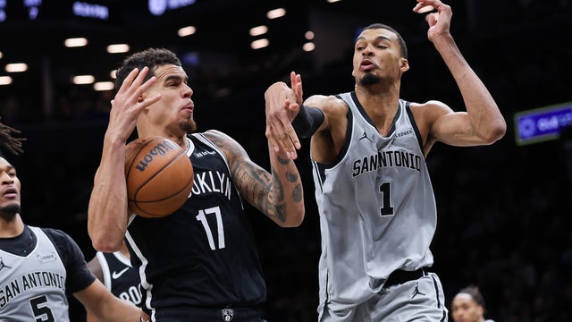 Michael Porter Jr. #17 of the Brooklyn Nets and Victor Wembanyama #1 of the San Antonio Spurs fight for a rebound during the second quarter at Barclays Center on February 26, 2026 in the Brooklyn borough of New York City. 