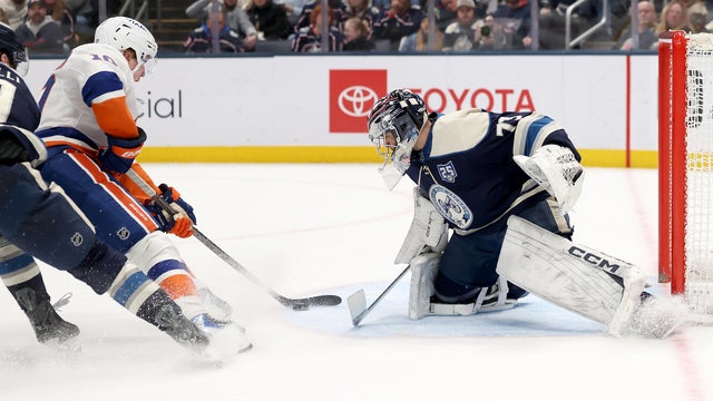 Simon Holmstrom #10 of the New York Islanders beats Jet Greaves #73 of the Columbus Blue Jackets for the game winning goal in overtime at Nationwide Arena on February 28, 2026 in Columbus, Ohio. 
