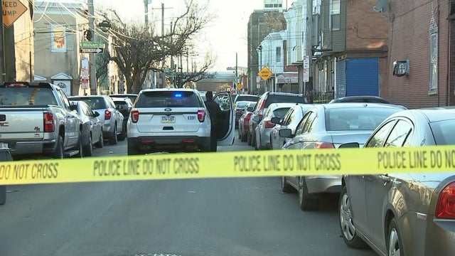 A police car and police tape are seen near a crime scene in the Kensington section of Philadelphia 