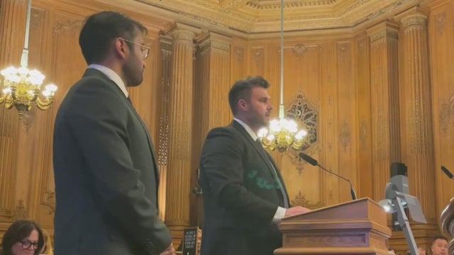 A man stands at a podium 